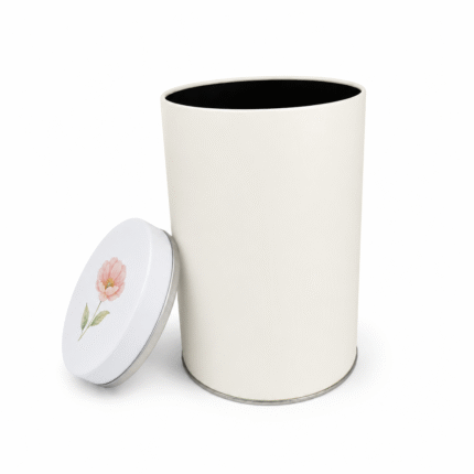 Open empty white metal tea canister