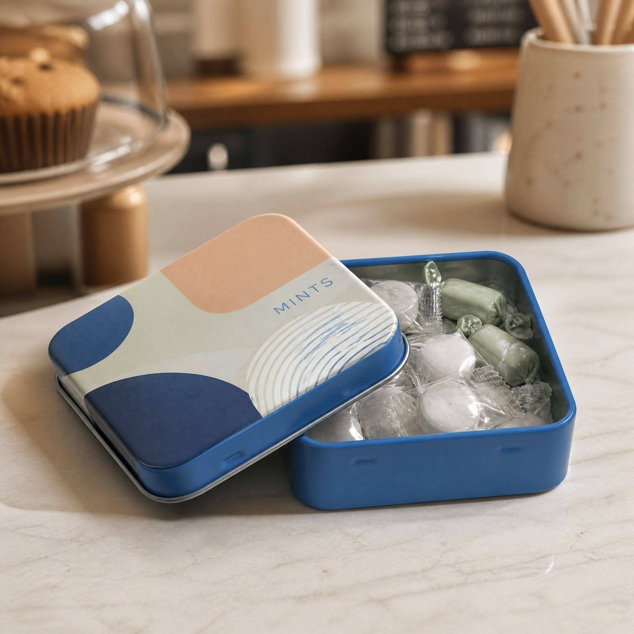 H5d642abc2e05416c937c30a3c64766edb Blue candy tin box filled with individually wrapped sweets