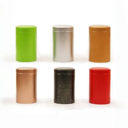 Colored cylindrical tea tins